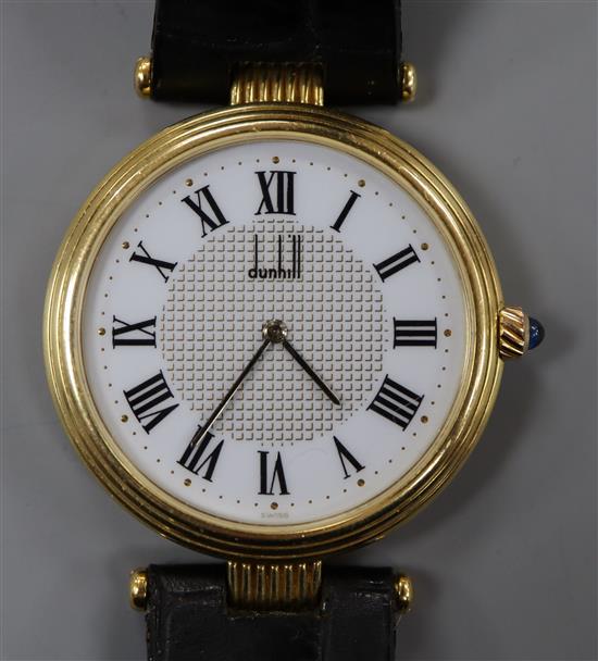 A gentlemans 18ct gold Dunhill automatic dress wrist watch, on a Dunhill leather strap,